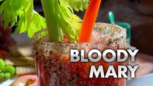 Bloody Mary cocktail with celery and tomato in a glass