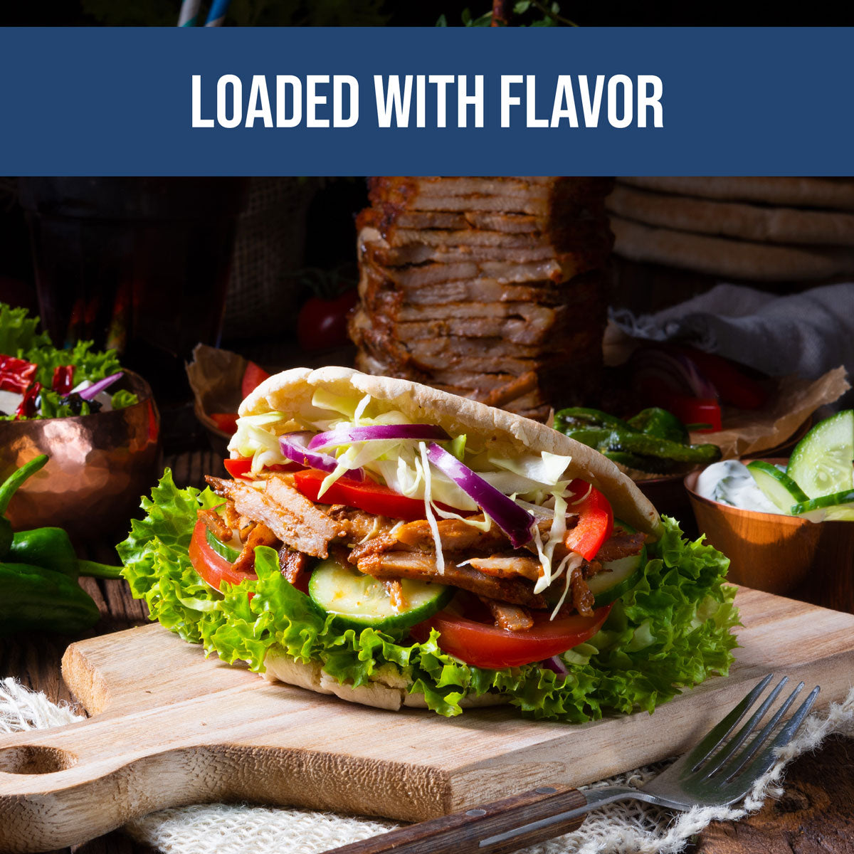 gyro seasoning on lamb kebab with lettuce, onions, tomatoes with side of greek tzatziki and cucumber