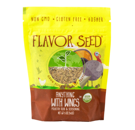 A Flavor Seed Anything With Wings organic poultry rub and seasoning pouch, yellow with a turkey and chicken illustration and a window showing the coarse seasoning blend inside.