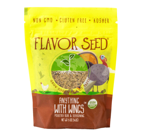 A Flavor Seed Anything With Wings organic poultry rub and seasoning pouch, yellow with a turkey and chicken illustration and a window showing the coarse seasoning blend inside.