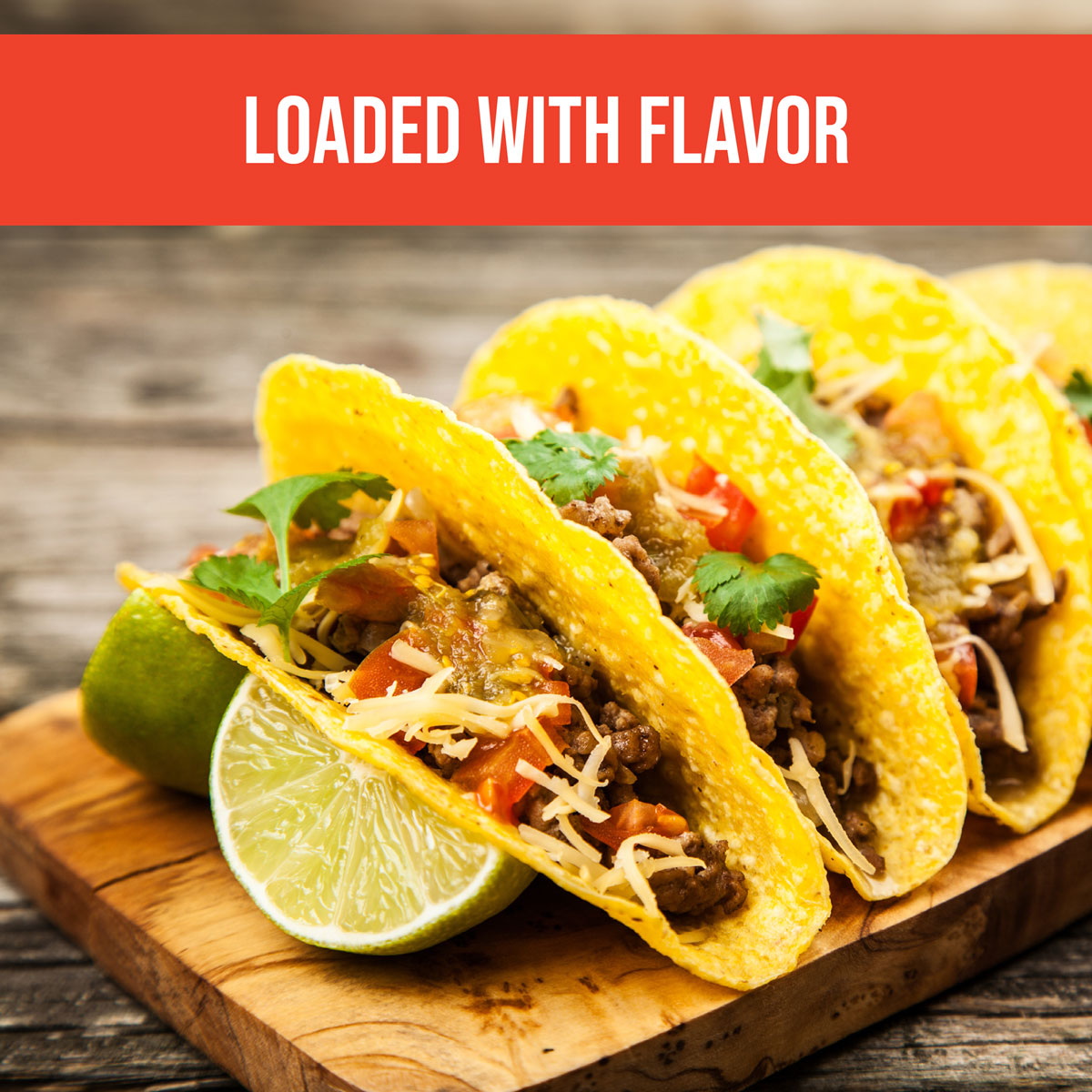 beef tacos filled with ground beef, cheese, tomatoes, organic taco seasoning with slices of lime