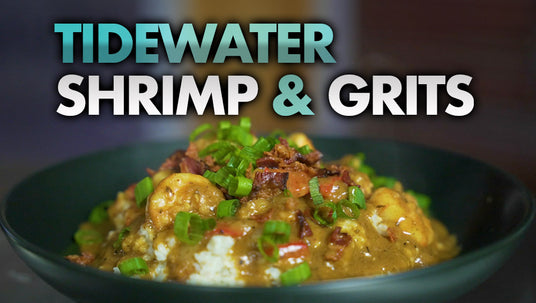 Bowl of Tidewater Shrimp & Grits garnished with fresh green onion