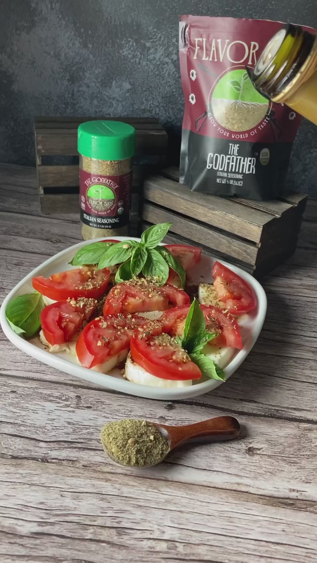 The Godfather organic Italian seasoning on a tomato, mozzarella and basil caprese with olive oil